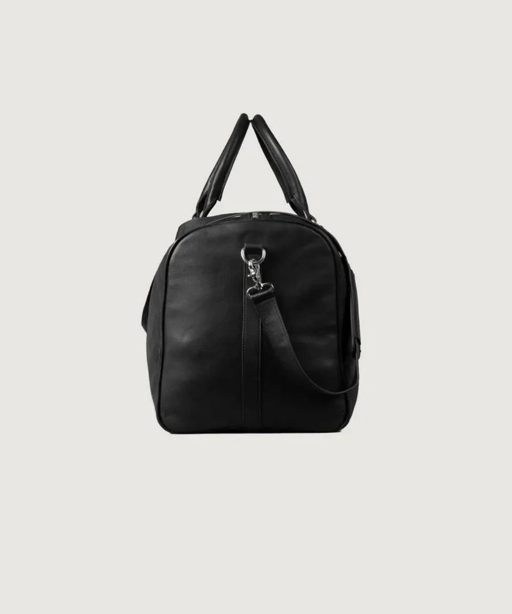 Black leather travel bag with adjustable shoulder strap