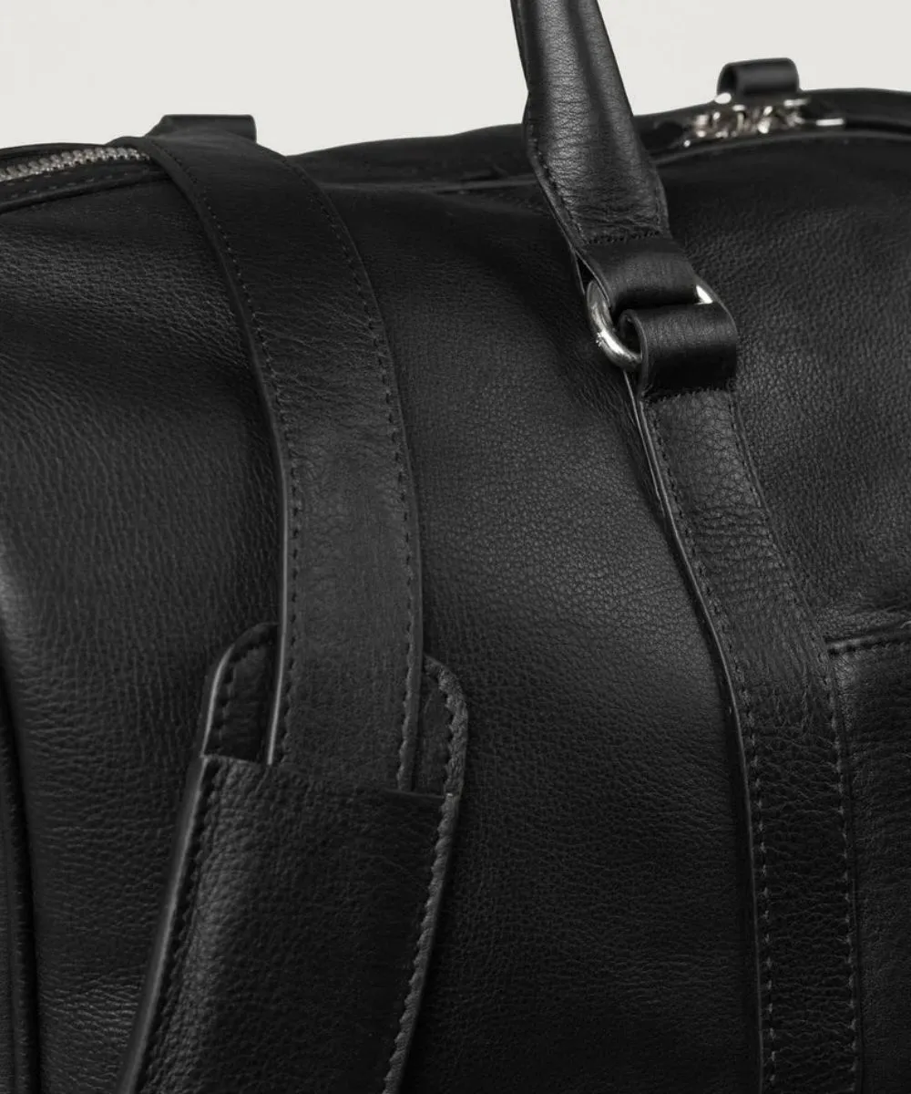 Black leather duffle bag interior with pockets