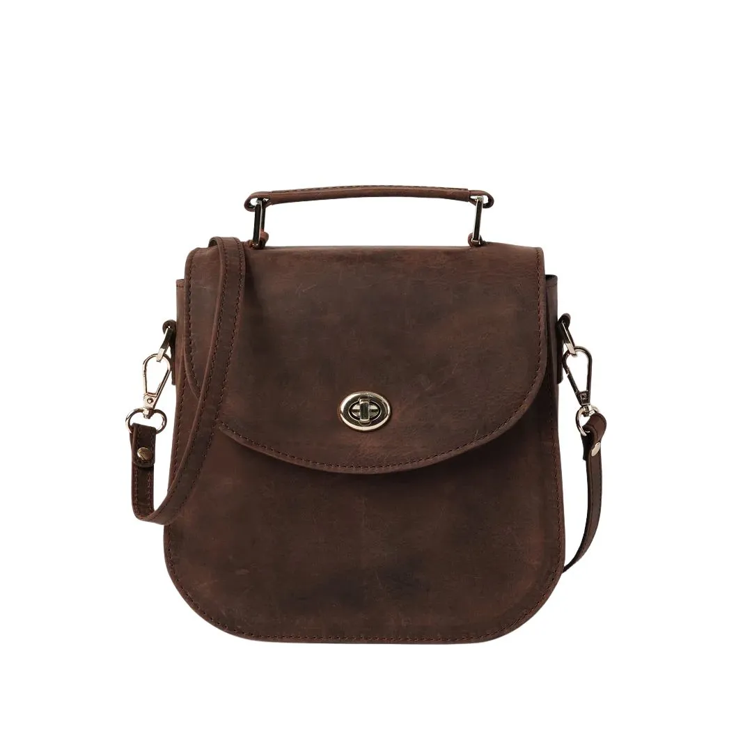 Vintage leather saddle bag with top handle and shoulder strap